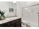 Bathroom with a glass-enclosed shower and a vanity with granite countertops at 50 Carolina Cherry Dr, Las Vegas, NV 89141