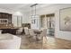Open-concept dining area with sliding glass doors to outdoor living space and stylish décor at 50 Carolina Cherry Dr, Las Vegas, NV 89141