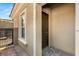 Exterior of home featuring front door and gated courtyard at 50 Carolina Cherry Dr, Las Vegas, NV 89141