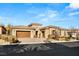 Charming single story home with a two-car garage, tiled roof, and low maintenance landscaping at 50 Carolina Cherry Dr, Las Vegas, NV 89141