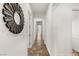 Bright hallway with tile flooring and a decorative mirror at 50 Carolina Cherry Dr, Las Vegas, NV 89141