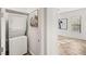 Hallway laundry closet with stacked washer and dryer, conveniently located near bedrooms at 50 Carolina Cherry Dr, Las Vegas, NV 89141