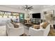 Bright living room with large sliding glass doors that offers easy access to the backyard pool at 50 Carolina Cherry Dr, Las Vegas, NV 89141