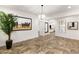 Bright living room showcasing neutral decor, tile flooring, and an open layout with stylish furnishings at 50 Carolina Cherry Dr, Las Vegas, NV 89141