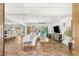 Bright and airy living room with modern furnishings and seamless access to the outdoor pool area at 50 Carolina Cherry Dr, Las Vegas, NV 89141