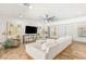 Open-concept living room with a ceiling fan and decorative artwork, creating a welcoming space at 50 Carolina Cherry Dr, Las Vegas, NV 89141