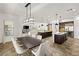 Spacious open-concept living space with a dining area, kitchen, and comfortable seating at 50 Carolina Cherry Dr, Las Vegas, NV 89141