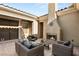 Inviting outdoor space with fireplace and comfortable seating, creating a cozy retreat at 50 Carolina Cherry Dr, Las Vegas, NV 89141