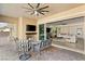 Covered outdoor patio offers a cozy fireplace, comfortable seating and seamless indoor-outdoor flow at 50 Carolina Cherry Dr, Las Vegas, NV 89141