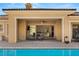 Outdoor patio with a cozy fireplace provides a seamless transition from indoor to outdoor living at 50 Carolina Cherry Dr, Las Vegas, NV 89141