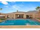 Inviting backyard features a refreshing private pool and outdoor kitchen area at 50 Carolina Cherry Dr, Las Vegas, NV 89141