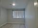 A small bedroom with vinyl flooring and a window at 5044 S Rainbow Blvd # 106, Las Vegas, NV 89118
