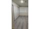 Bedroom featuring a closet and wood-look flooring at 5044 S Rainbow Blvd # 106, Las Vegas, NV 89118