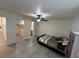 Bedroom featuring a ceiling fan, bed, closet, and wood-look flooring at 5044 S Rainbow Blvd # 106, Las Vegas, NV 89118