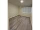 A small bedroom with vinyl flooring and a window at 5044 S Rainbow Blvd # 106, Las Vegas, NV 89118