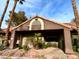 Inviting clubhouse featuring lush landscaping, Vizcaya sign, and barrel tile roof in a well-maintained community at 5044 S Rainbow Blvd # 106, Las Vegas, NV 89118
