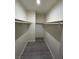 Walk-in closet with shelving and wood-look flooring at 5044 S Rainbow Blvd # 106, Las Vegas, NV 89118