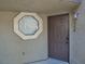 A front door with a digital lock and a unique octagon-shaped window at 5044 S Rainbow Blvd # 106, Las Vegas, NV 89118