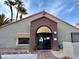 Exterior of community building with tile roof and arched entryway at 5044 S Rainbow Blvd # 106, Las Vegas, NV 89118
