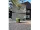 Exterior view of the building with trimmed bushes and rock landscaping at 5044 S Rainbow Blvd # 106, Las Vegas, NV 89118