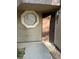 Exterior view of the front door with unique window and covered entry at 5044 S Rainbow Blvd # 106, Las Vegas, NV 89118