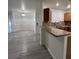 Open floor plan featuring a kitchen with granite counters and a breakfast bar at 5044 S Rainbow Blvd # 106, Las Vegas, NV 89118