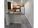 Updated kitchen features wood cabinets, granite countertops and stainless steel appliances at 5044 S Rainbow Blvd # 106, Las Vegas, NV 89118
