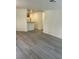 Open-concept living area featuring modern flooring leading to the kitchen at 5044 S Rainbow Blvd # 106, Las Vegas, NV 89118