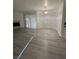 Living area featuring modern flooring, natural light, and a fireplace at 5044 S Rainbow Blvd # 106, Las Vegas, NV 89118