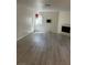 Neutral living space with a fireplace, a window, and modern flooring at 5044 S Rainbow Blvd # 106, Las Vegas, NV 89118