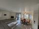 Open living area with fireplace, table, and sliding glass door leading to outdoor space at 5044 S Rainbow Blvd # 106, Las Vegas, NV 89118