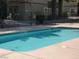 A relaxing swimming pool with clear blue water surrounded by a secure fence, perfect for recreation and leisure at 5044 S Rainbow Blvd # 106, Las Vegas, NV 89118