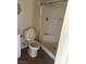 Bathroom featuring a toilet, sink, and shower with glass doors at 5115 Blossom Ave, Las Vegas, NV 89142