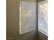 This bedroom offers a sunny view through windows with blinds at 5115 Blossom Ave, Las Vegas, NV 89142