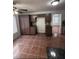 Well-equipped kitchen with dark wood cabinets, granite countertops, and stainless steel appliances at 5115 Blossom Ave, Las Vegas, NV 89142