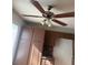 This kitchen features an ceiling fan with lights, granite counters, and custom wood cabinets at 5115 Blossom Ave, Las Vegas, NV 89142