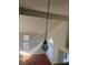 Living space boasts high ceilings, ample natural light, and a decorative pendant light at 5115 Blossom Ave, Las Vegas, NV 89142