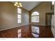 Living room with lots of natural light, vaulted ceiling, and tile flooring throughout at 5115 Blossom Ave, Las Vegas, NV 89142