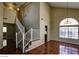 Open floor plan featuring tile flooring, stairs and railing, and large windows at 5115 Blossom Ave, Las Vegas, NV 89142