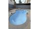 Backyard showcasing a refinished in-ground pool, stone pavers, and privacy fence at 5115 Blossom Ave, Las Vegas, NV 89142