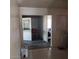 Bright entryway showcasing wood-look floors and an open dining room at 5284 Wellesley Ave, Las Vegas, NV 89122