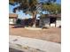 An image of the front yard with a single tree in a decorative rock border at 5284 Wellesley Ave, Las Vegas, NV 89122