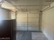 Uncluttered garage featuring neutral walls and a standard garage door at 5284 Wellesley Ave, Las Vegas, NV 89122
