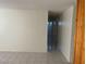 Hallway with tile floors and neutral paint leads to bedrooms and bathrooms at 5284 Wellesley Ave, Las Vegas, NV 89122
