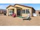 Cozy backyard with patio, modern outdoor furniture, and neutral rock landscaping at 5467 Eleganza Ave, Pahrump, NV 89061