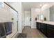 Bathroom featuring glass shower, double sinks, and modern fixtures at 5467 Eleganza Ave, Pahrump, NV 89061
