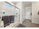 Contemporary bathroom with a glass-enclosed shower and stylish gray towels at 5467 Eleganza Ave, Pahrump, NV 89061