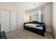 Neutral bedroom featuring a slider closet, a comfortable day bed, and neutral decor at 5467 Eleganza Ave, Pahrump, NV 89061