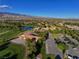 Aerial shot highlighting the community clubhouse, golf course, and mountain views at 5467 Eleganza Ave, Pahrump, NV 89061