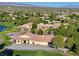 Aerial perspective of community, highlighting the golf course, clubhouse, and neighborhood at 5467 Eleganza Ave, Pahrump, NV 89061